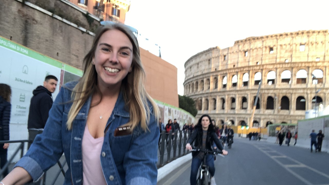 Bicycle near the Colosseum in Rome representing arts, communication, and society