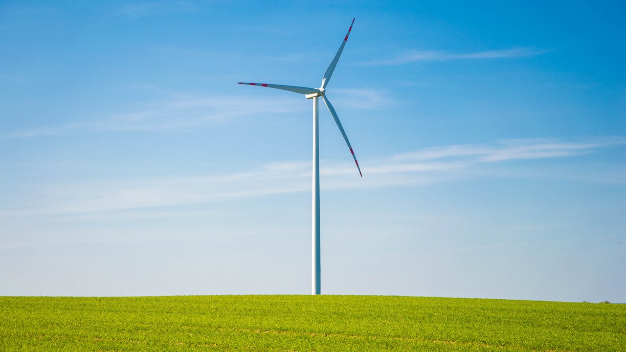 Wind turbines in a rural landscape representing sustainability