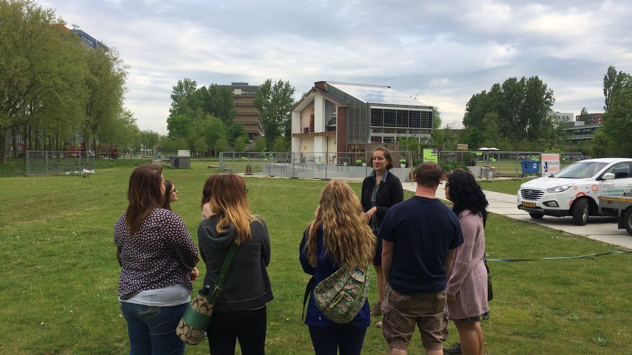 Students on an outdoor site visit with a guide